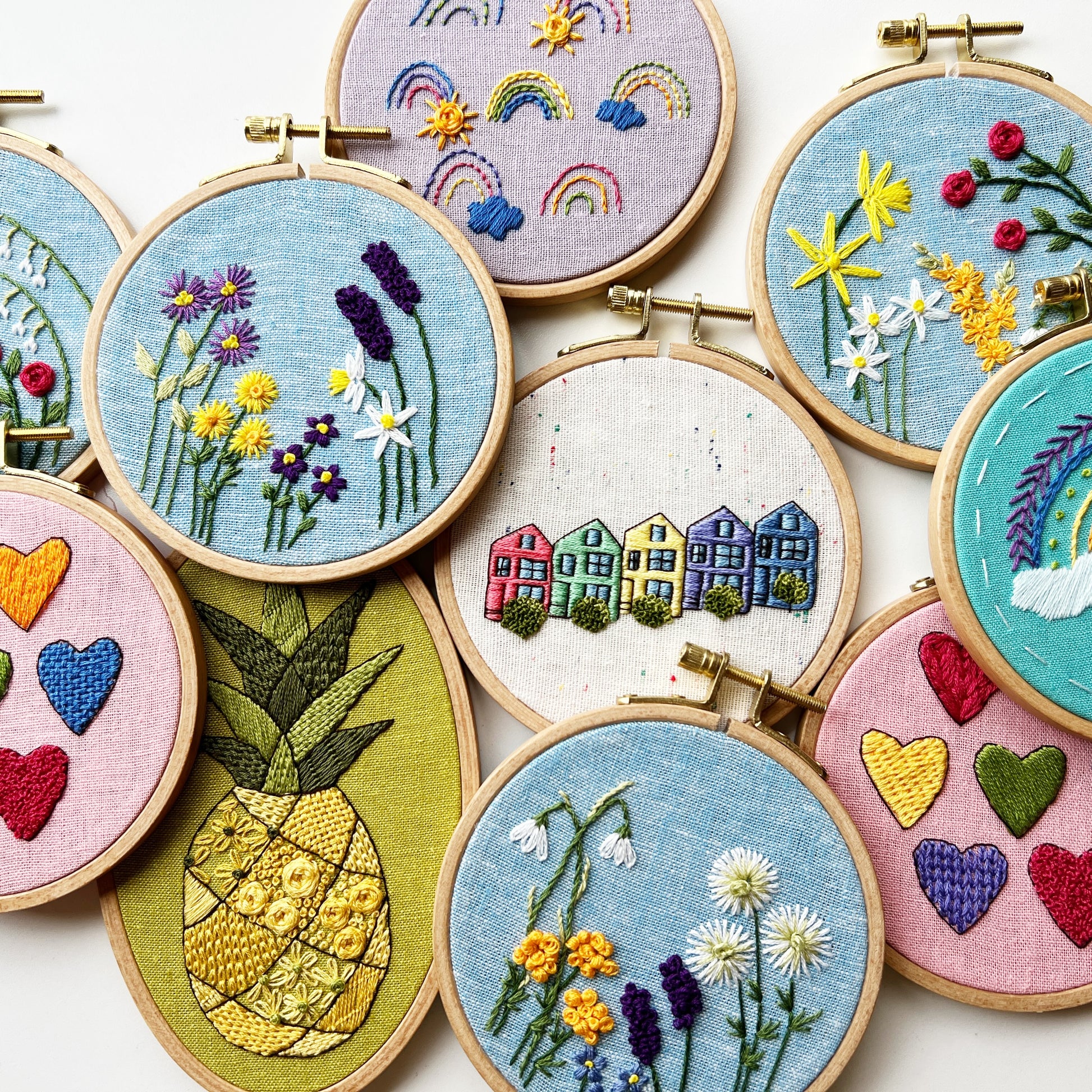 a collection of finished embroidery in the hoop.