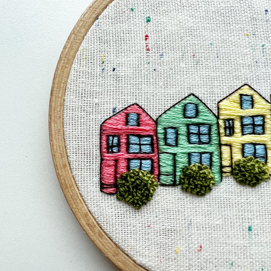 Close up of Rosanna Diggs Embroidery Kit Painted Ladies.  Stitch detail defines windows and shrubs.