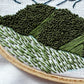 Close up of foreground development of Hurricane Ridge Embroidery.  Using traced lines from pattern trees and hillsides have been completed while grass has been started.