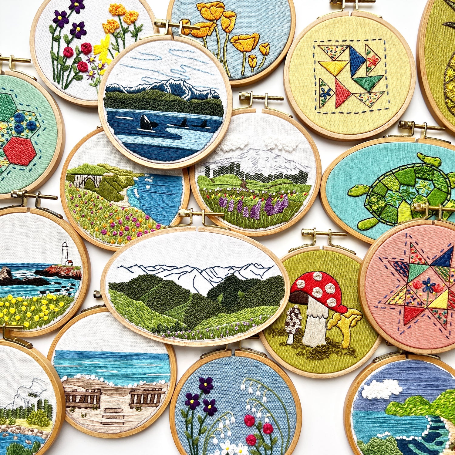 a collage of finished embroidery hoops featuring landscapes, botanicals, and quilt patterns