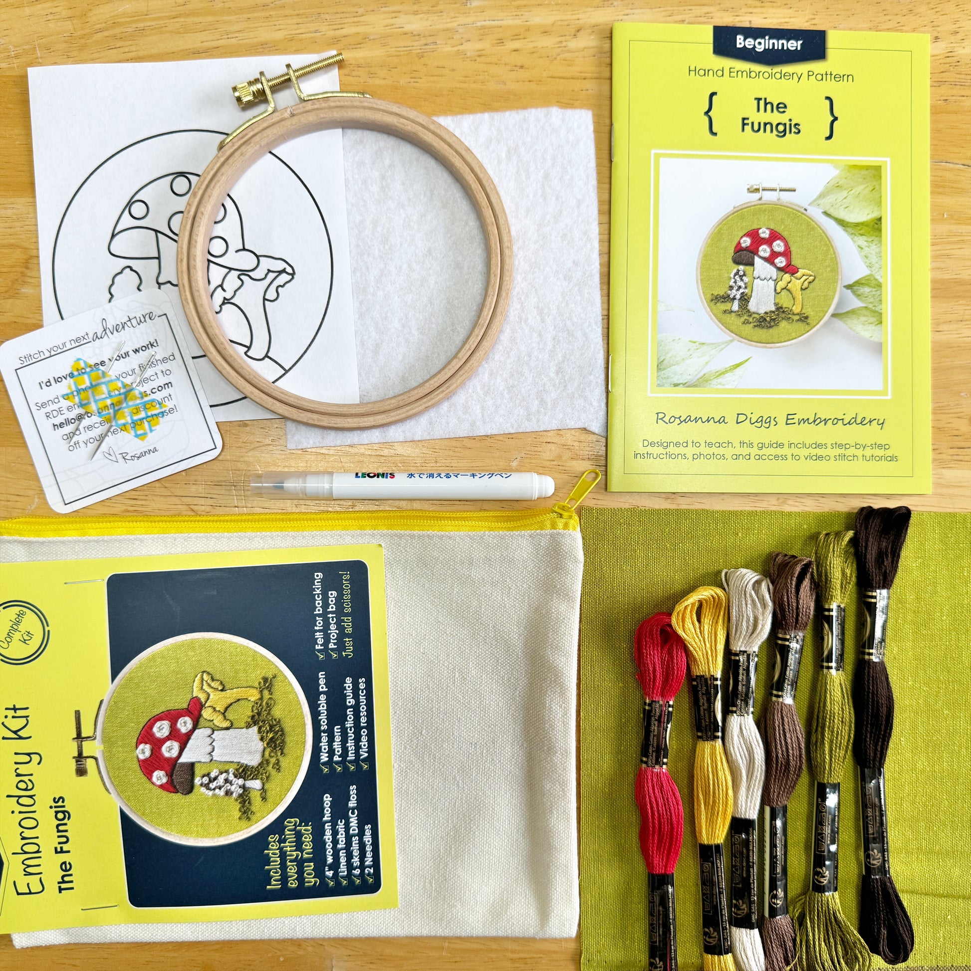 You will need: 4 inch wooden hoop, 6 inch square linen fabric, water soluble pen, 6 strand embroidery floss, needle, felt for backing, pattern, step-by-step instructions